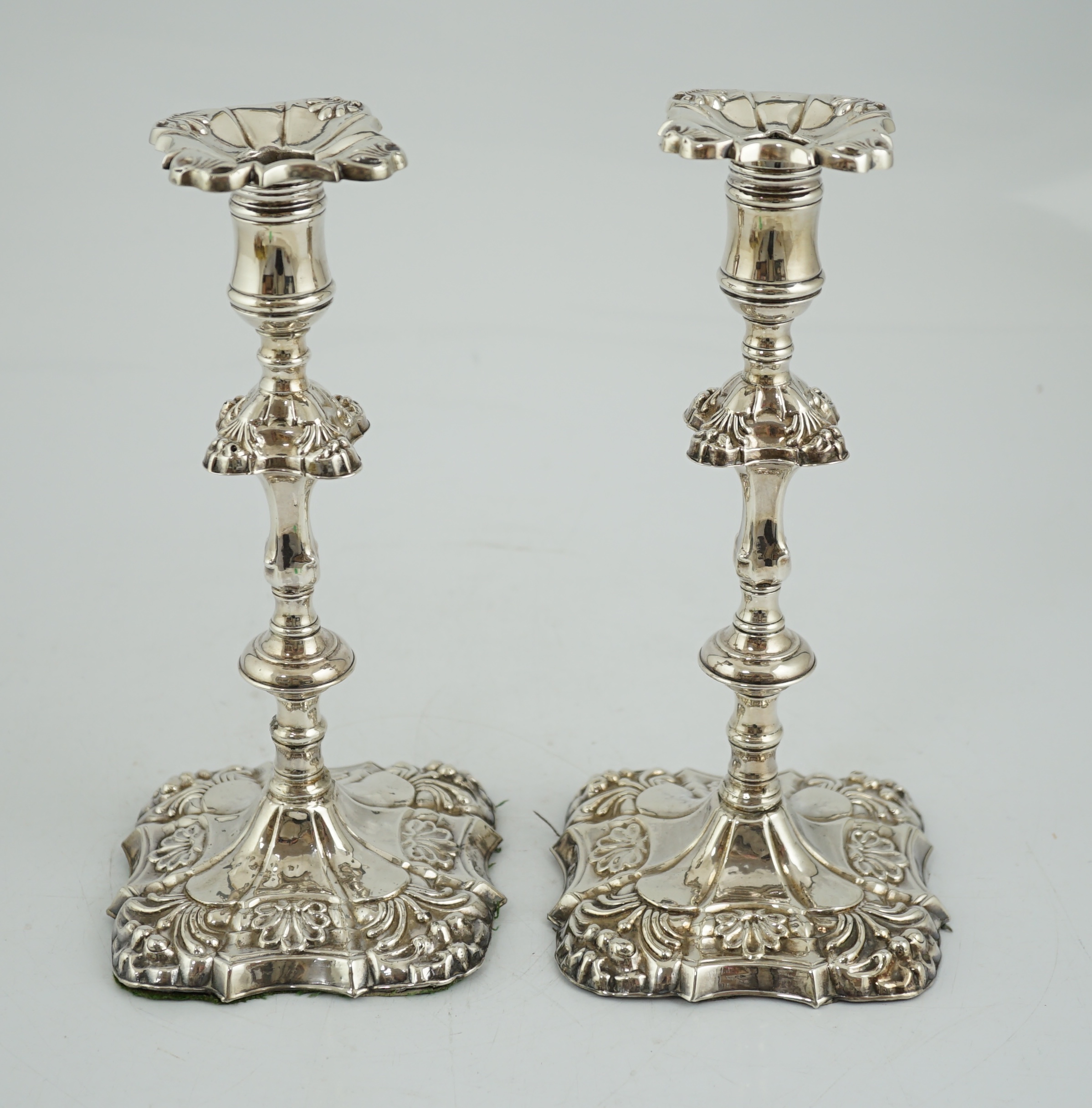 A pair of early George III silver candlesticks, by James Stamp & John Baker